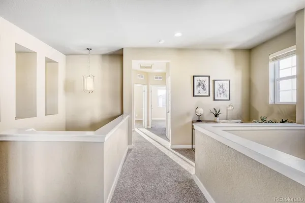 a spacious bathroom with a tub sink and mirror