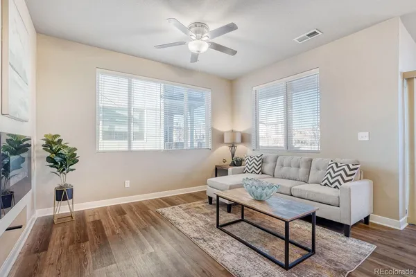 a living room with furniture and a large window