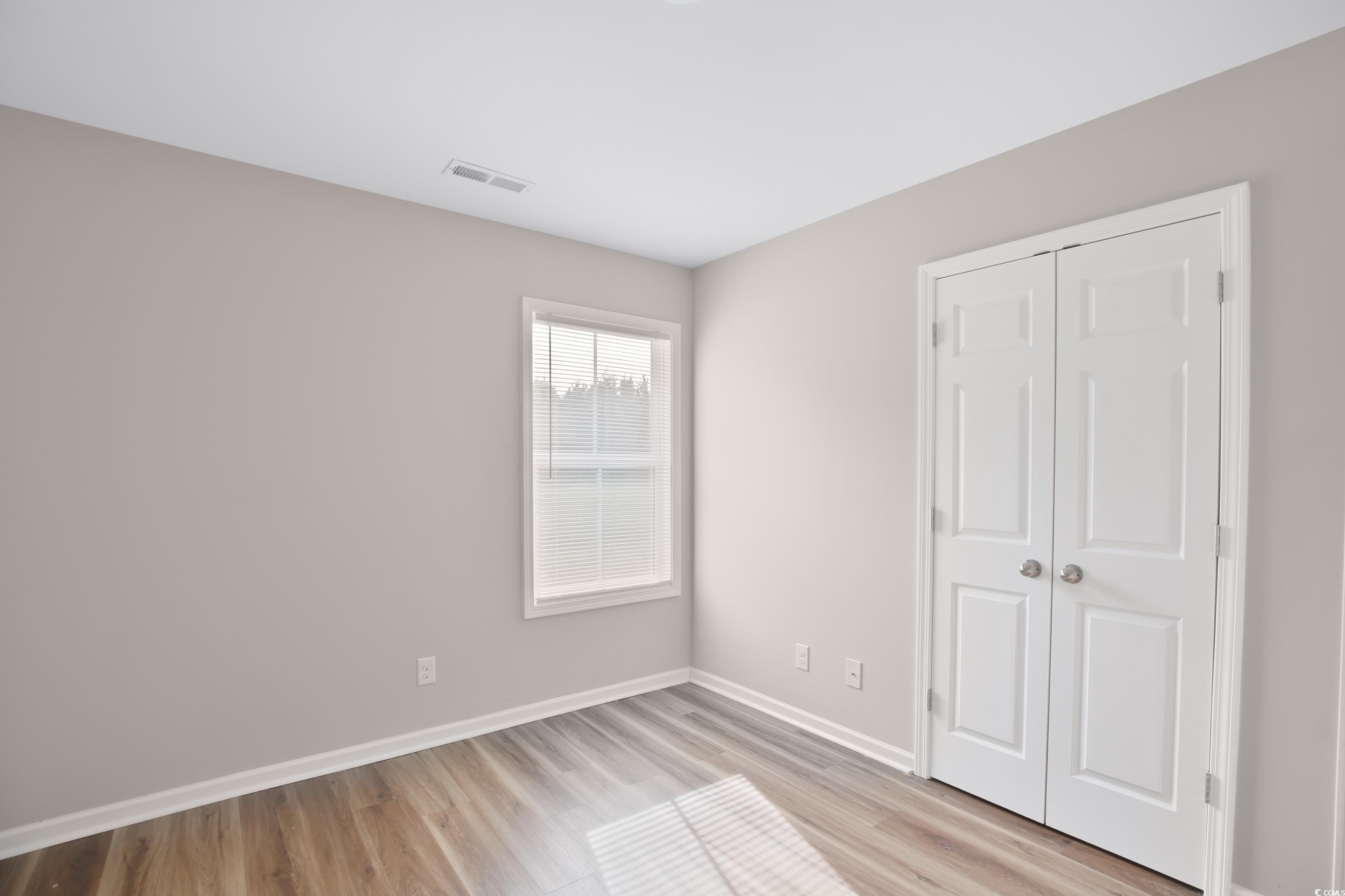 168 Rosedale Drive Aynor, SC 29511 - Photo 5 of 20 Unfurnished bedroom with light wood-type flooring