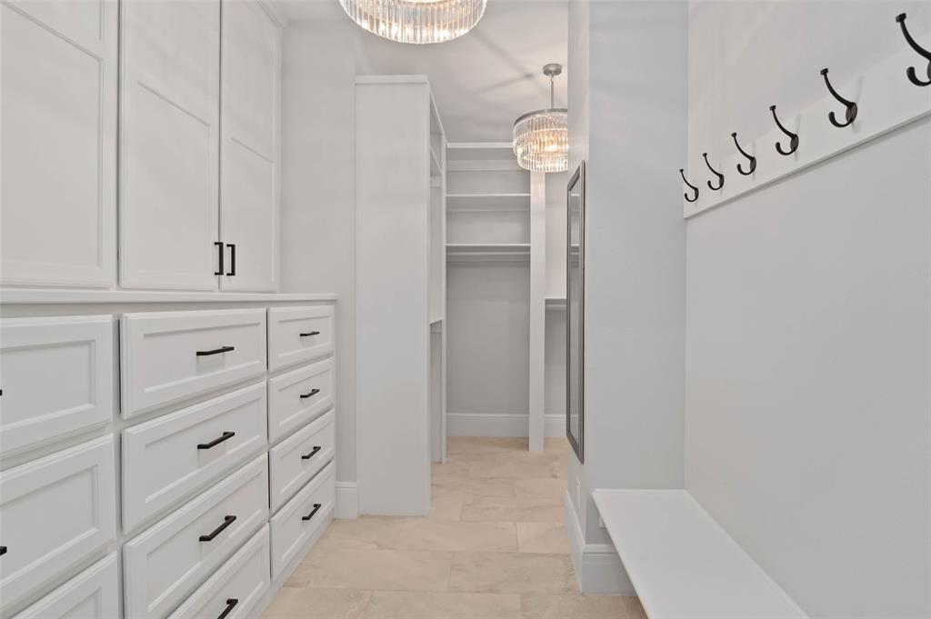 124 Garza Road Shady Shores, TX 76208 - Photo 19 of 40 Amazing primary closet featuring all the built in storage you need.