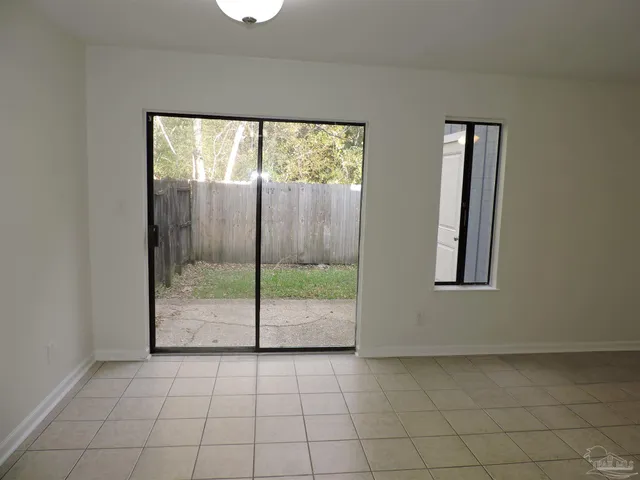 a view of an empty room and window
