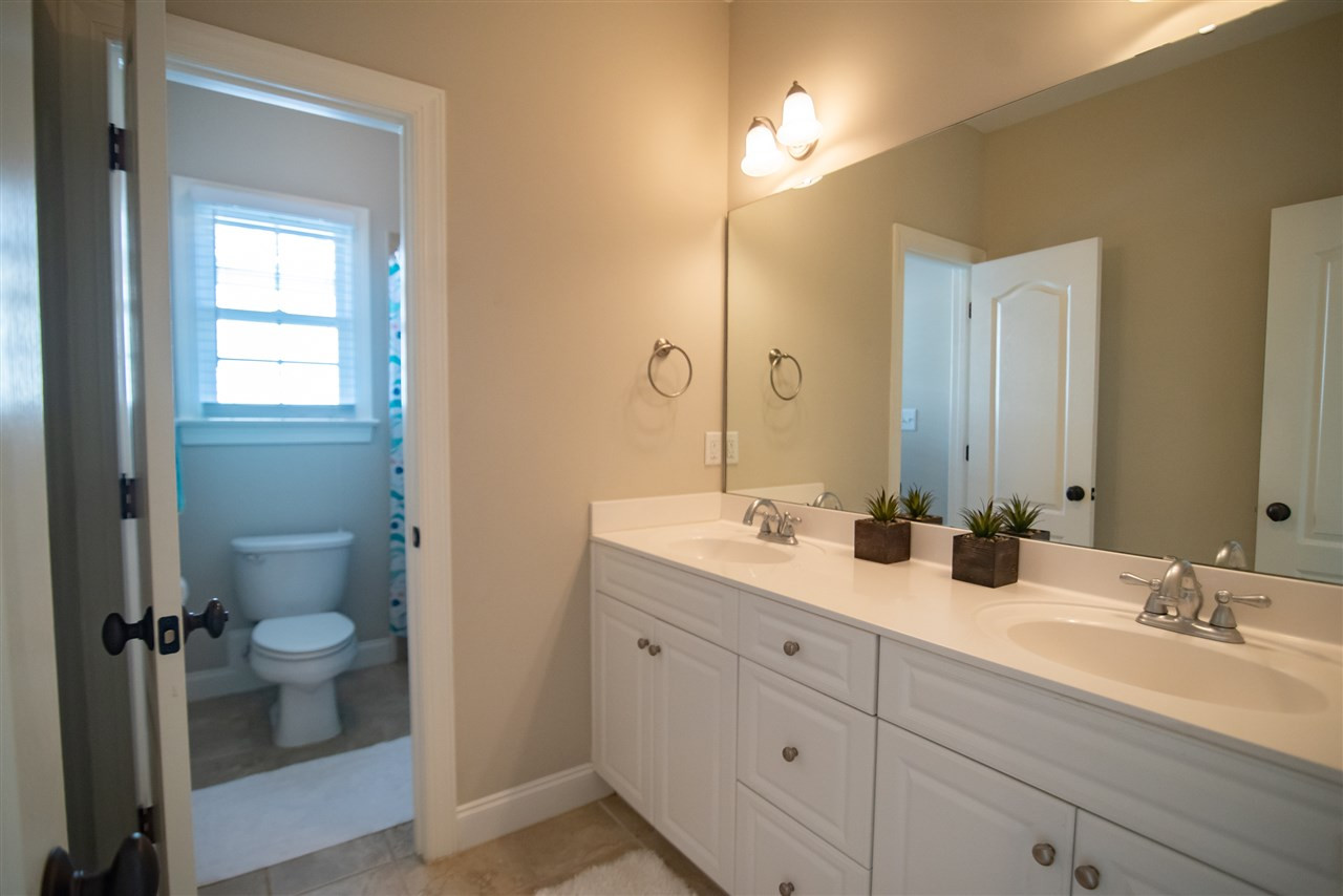 2203 Hopeton Avenue Raleigh, NC 27614 - Photo 19 of 25 Double vanity sink and separate shower area. Hall Bathroom