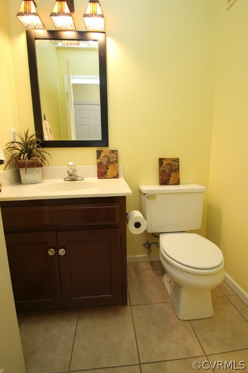 5708 Sandstone Ridge Terrace Midlothian, VA 23112 - Photo 11 of 23 a bathroom with a toilet a sink and mirror