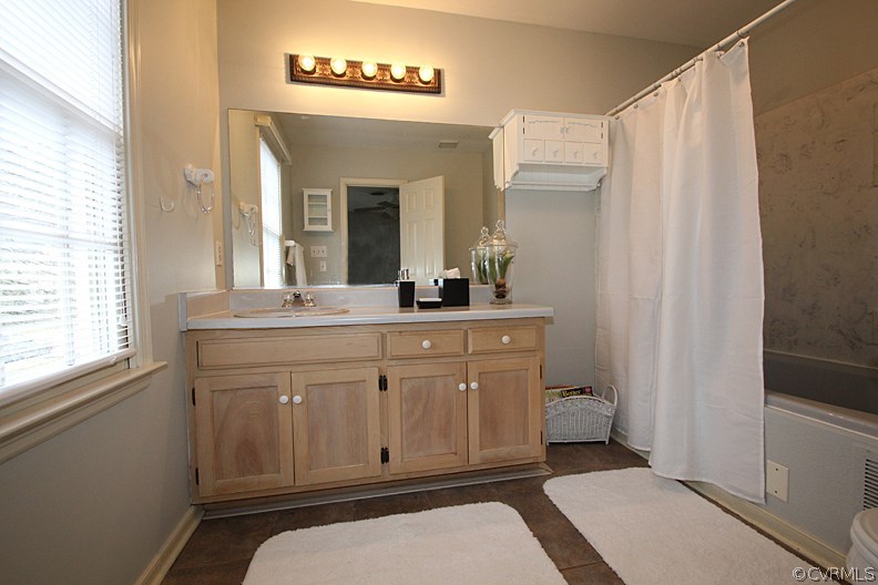 5708 Sandstone Ridge Terrace Midlothian, VA 23112 - Photo 14 of 23 a bathroom with a sink a mirror and a toilet