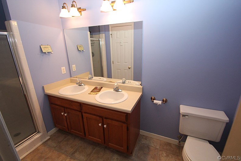 5708 Sandstone Ridge Terrace Midlothian, VA 23112 - Photo 17 of 23 a bathroom with a sink toilet and mirror