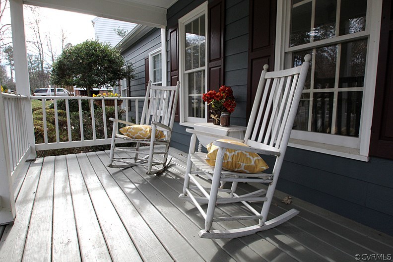 5708 Sandstone Ridge Terrace Midlothian, VA 23112 - Photo 2 of 23 a view of balcony with wooden floor outdoor seating and yard in the back