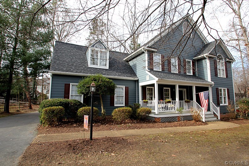 5708 Sandstone Ridge Terrace Midlothian, VA 23112 - Photo 22 of 23 a front view of a house with garden
