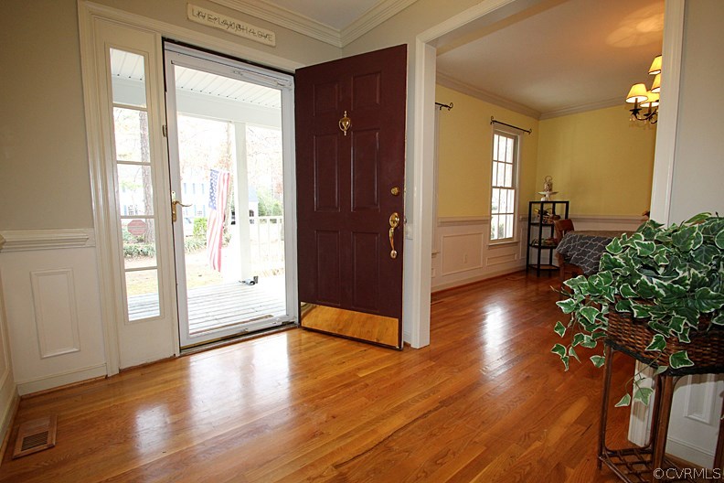 5708 Sandstone Ridge Terrace Midlothian, VA 23112 - Photo 3 of 23 an empty room with wooden floor and windows