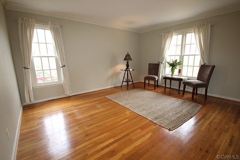 5708 Sandstone Ridge Terrace Midlothian, VA 23112 - Photo 4 of 23 an empty room with wooden floor and windows