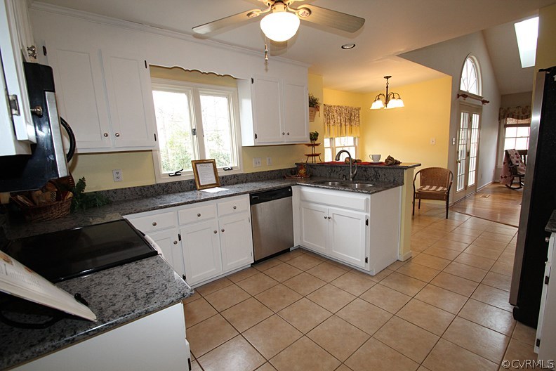 5708 Sandstone Ridge Terrace Midlothian, VA 23112 - Photo 6 of 23 a kitchen with a sink stove and cabinets
