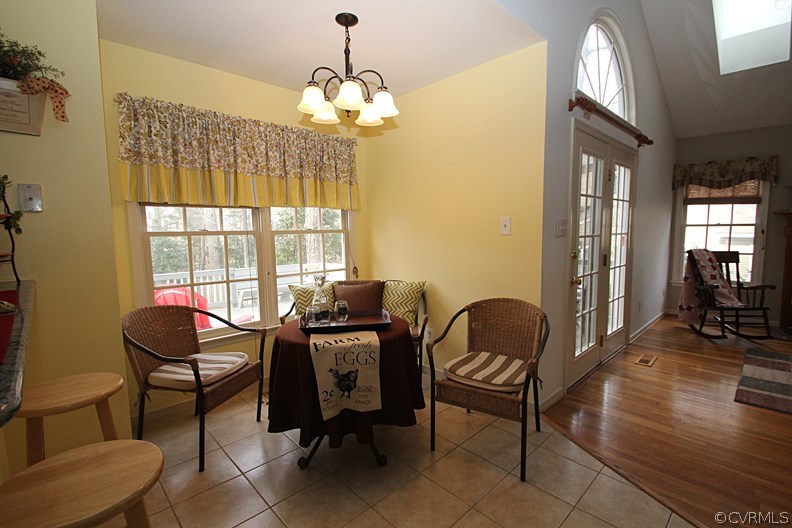 5708 Sandstone Ridge Terrace Midlothian, VA 23112 - Photo 9 of 23 a view of a livingroom with workspace and windows
