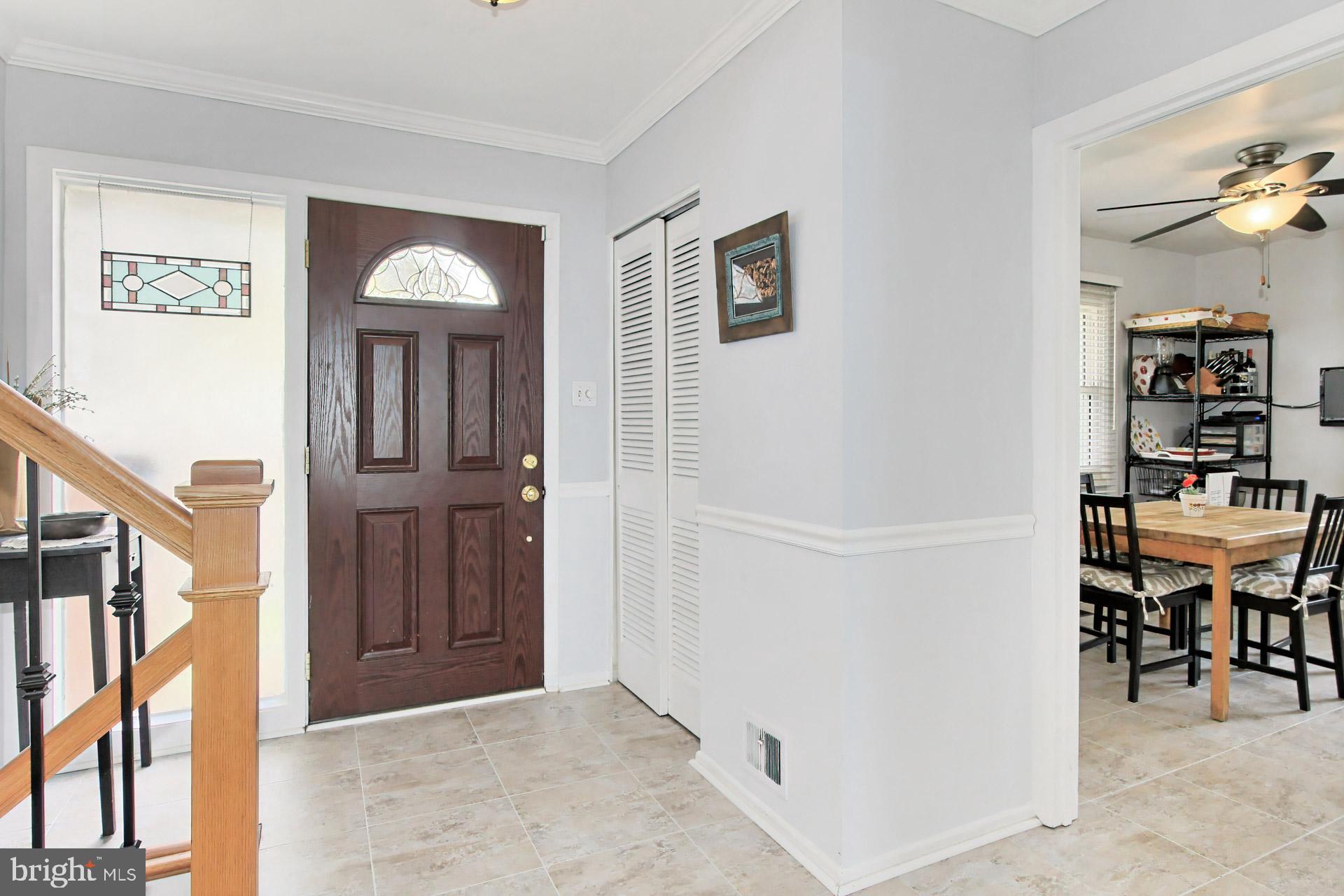 6011 Meriwether Lane Springfield, VA 22150 - Photo 6 of 53 Groutable Luxury Vinyl Tile in foyer & kitchen