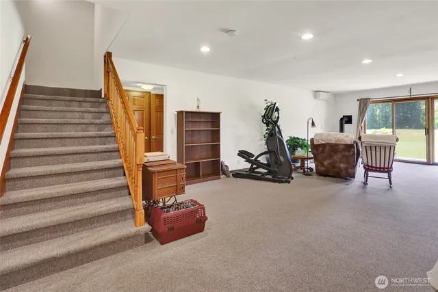 a view of a livingroom with furniture and a staircase