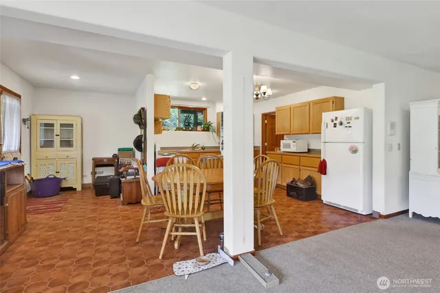 a livingroom with furniture and a flat screen tv