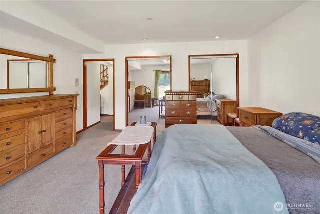 a bed room with a bed and furniture