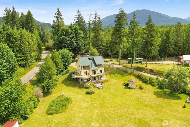 a view of a backyard with swimming pool