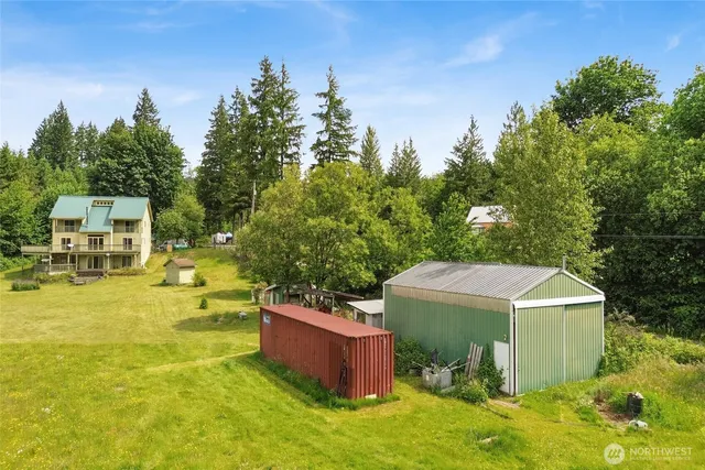 a view of a swimming pool with a yard