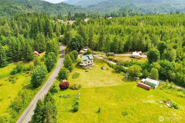 a view of ocean with green space