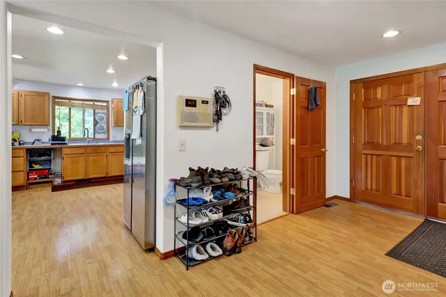 a bedroom with furniture and a wooden floor