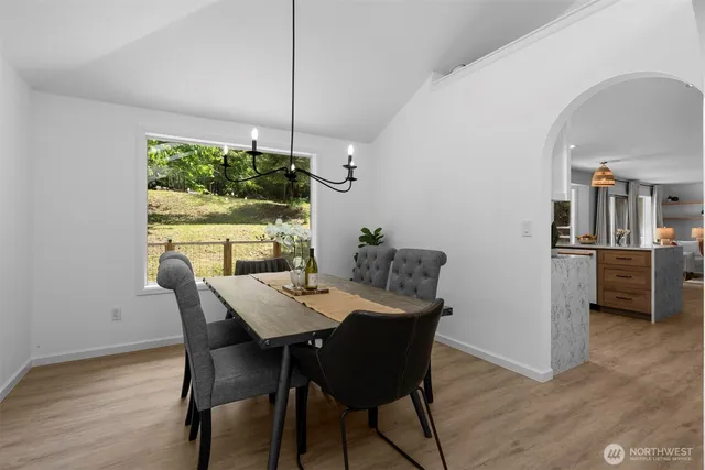 a view of a dining room with furniture window and wooden floor