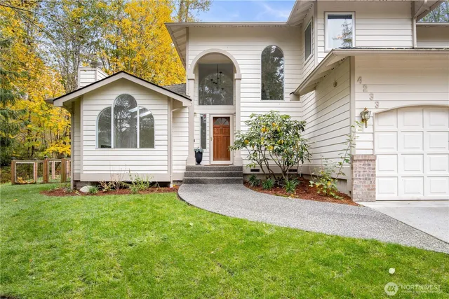 a front view of a house with a yard