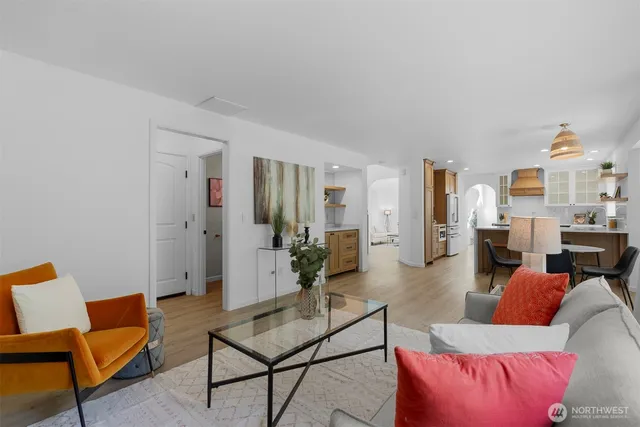 a bathroom with a sink mirror and toilet