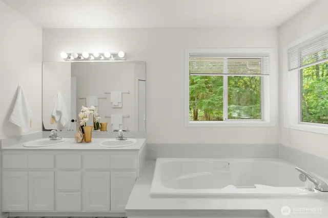 a bedroom with a bed and a lamp