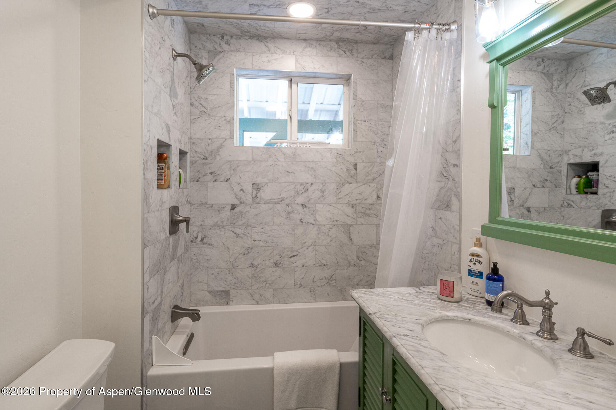 285 Conundrum Creek Road Aspen, CO 81611 - Photo 26 of 35 a bathroom with a granite countertop sink a mirror a bathtub and shower