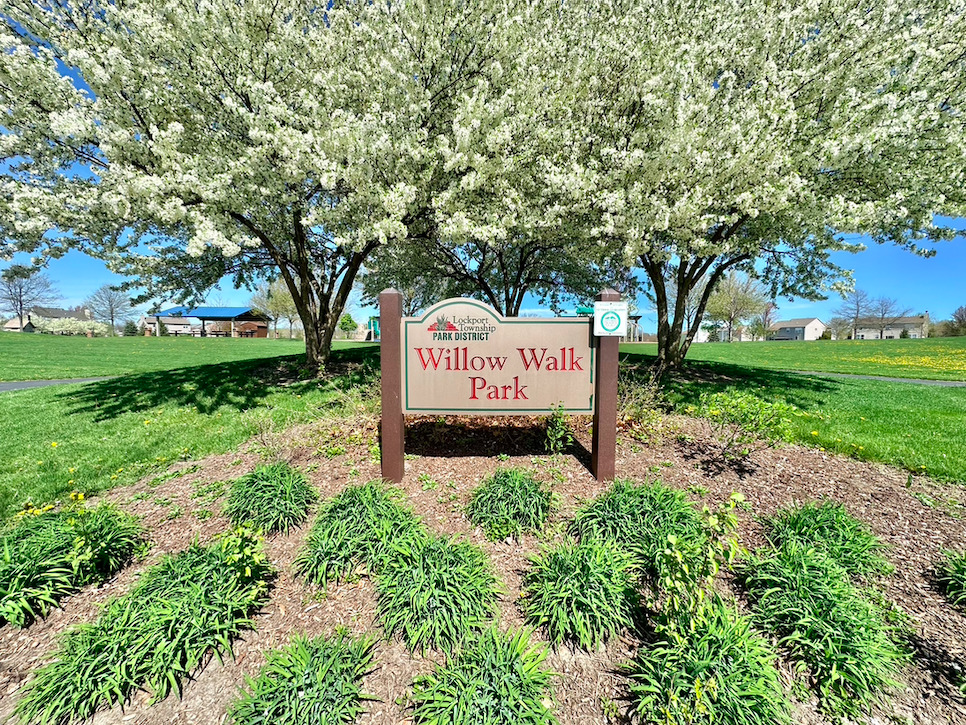 17523 Gilbert Drive Lockport, IL 60441 - Photo 29 of 34 a sign board with a park park bench and trees