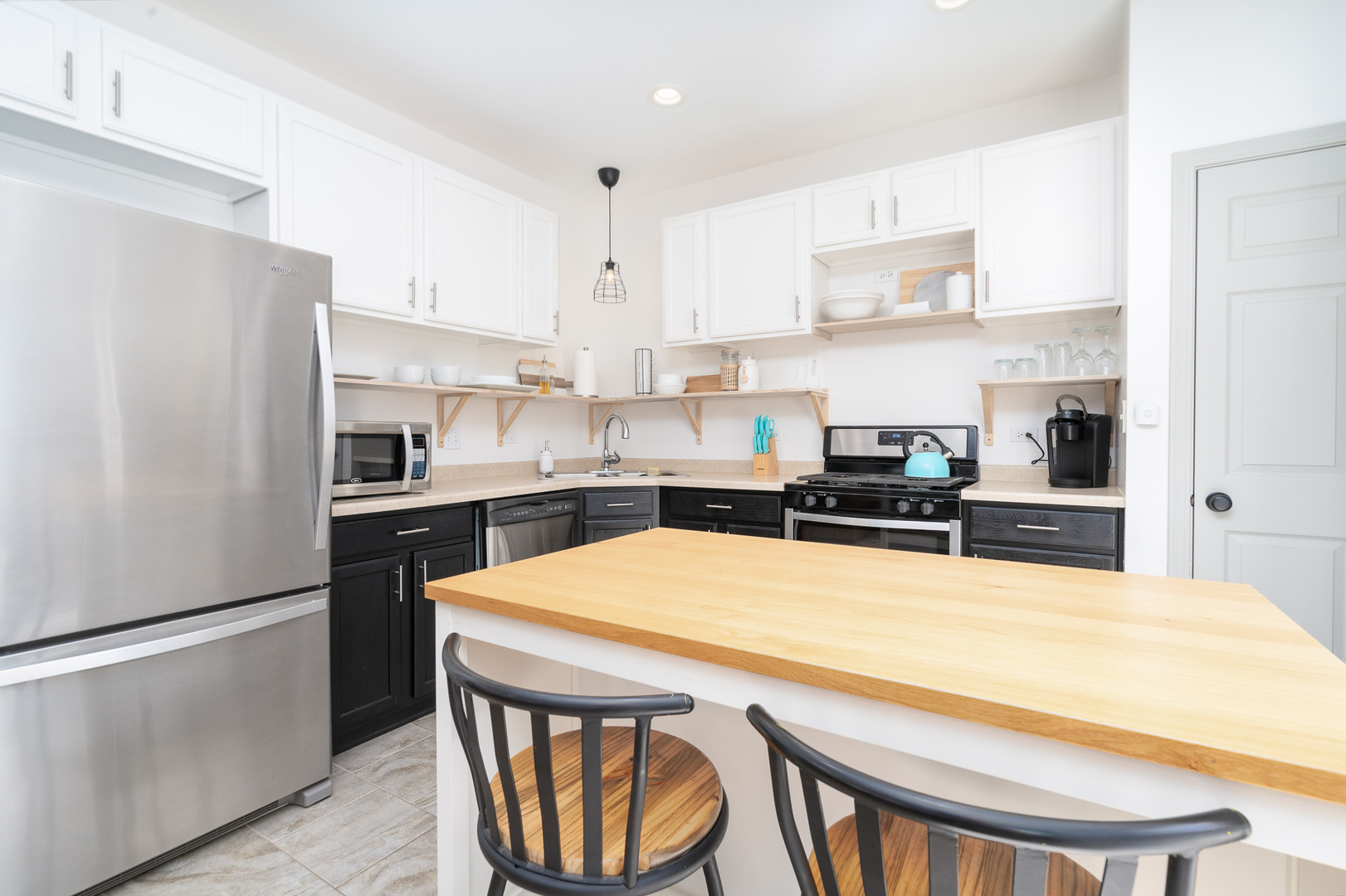 17523 Gilbert Drive Lockport, IL 60441 - Photo 3 of 34 a kitchen with stainless steel appliances a refrigerator a stove a sink and white cabinets with wooden floor