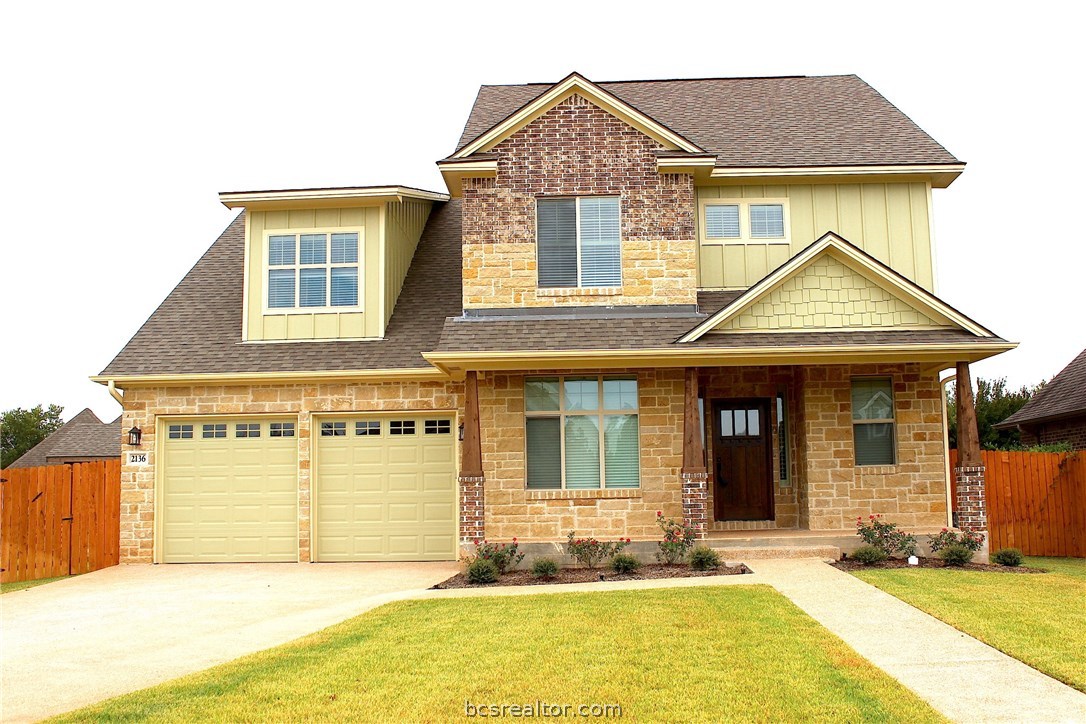 2136 Rockcliffe Loop College Station, TX 77845 - Photo 1 of 1 a front view of a house with a yard
