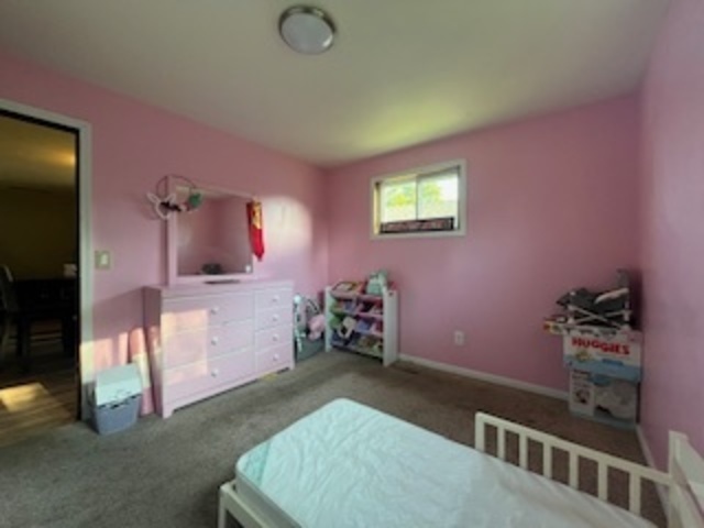 1581 South 4th Avenue Kankakee, IL 60901 - Photo 14 of 18 a bedroom with furniture and a window
