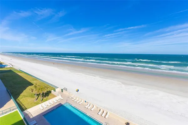 a bathroom with a toilet a sink and shower