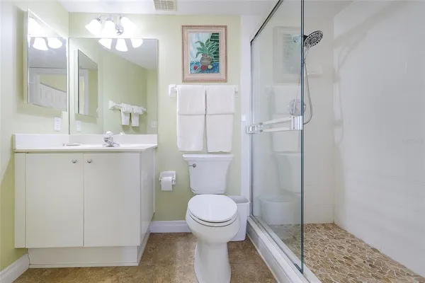 a bedroom with a bed and a table in it