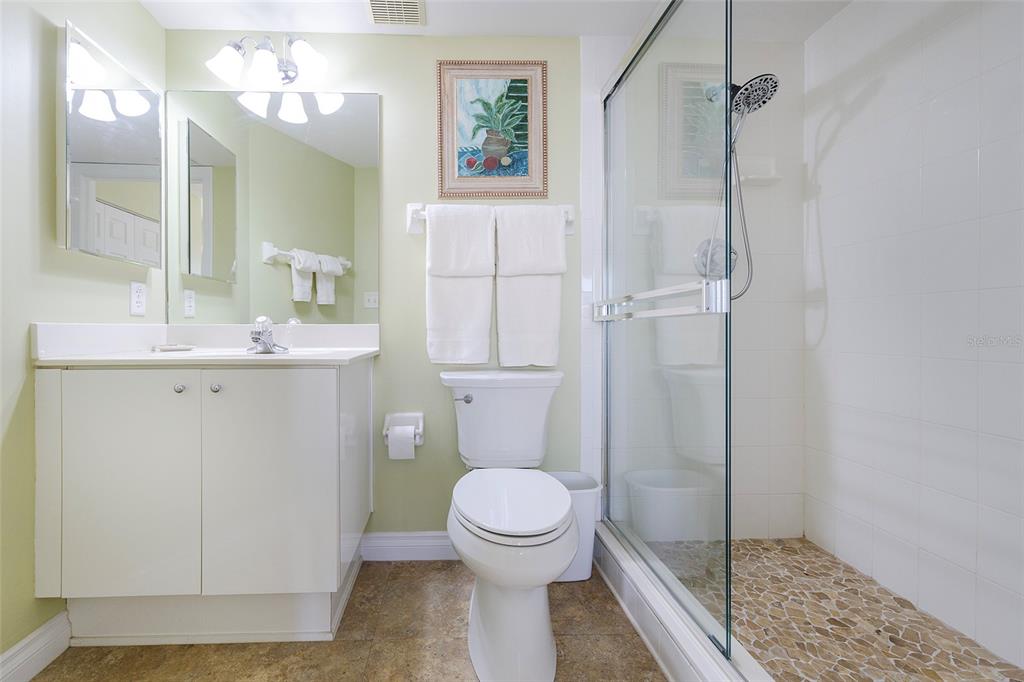 4631 South Atlantic Avenue, Unit 8601 Ponce Inlet, FL 32127 - Photo 22 of 64 a bathroom with a toilet a sink and shower