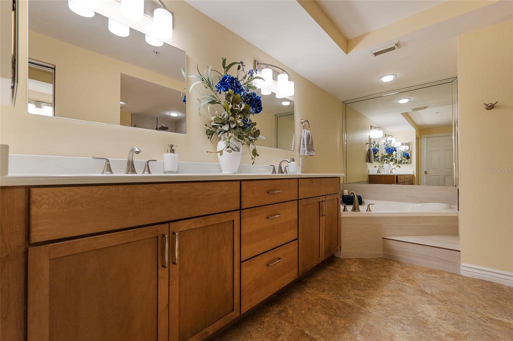 4631 South Atlantic Avenue, Unit 8601 Ponce Inlet, FL 32127 - Photo 24 of 64 a bathroom with a sink double vanity and a mirror