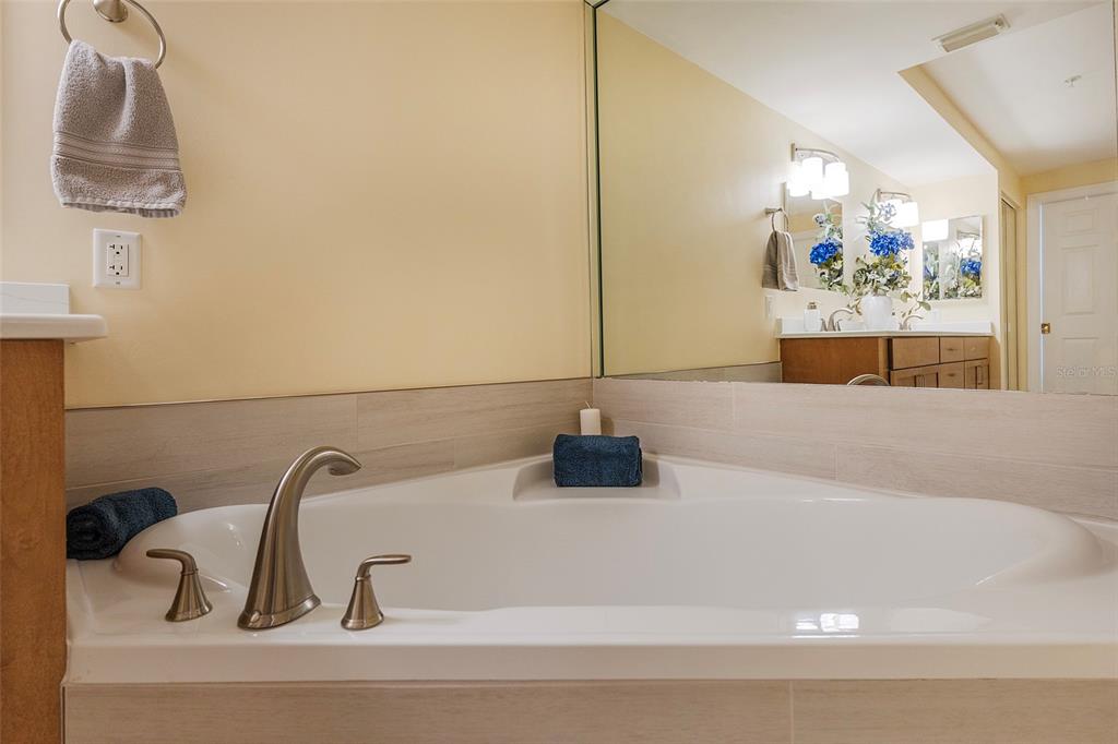 4631 South Atlantic Avenue, Unit 8601 Ponce Inlet, FL 32127 - Photo 27 of 64 a bathroom with a sink and a mirror