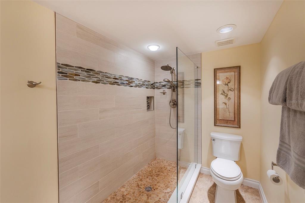 4631 South Atlantic Avenue, Unit 8601 Ponce Inlet, FL 32127 - Photo 29 of 64 a bathroom with a toilet and a shower