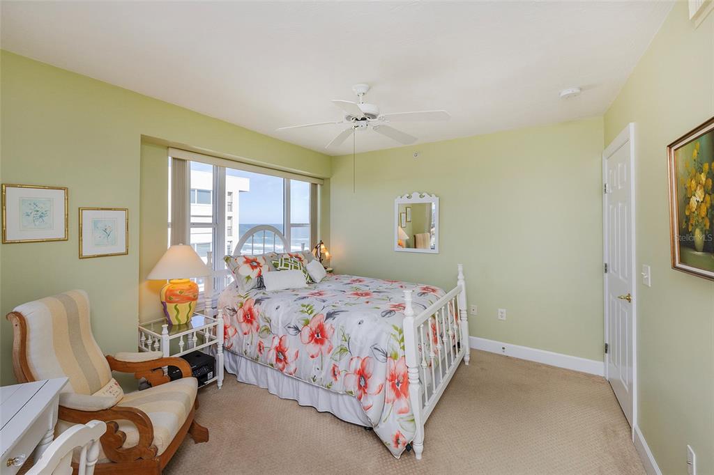 4631 South Atlantic Avenue, Unit 8601 Ponce Inlet, FL 32127 - Photo 31 of 64 a bedroom with a bed bathroom and window
