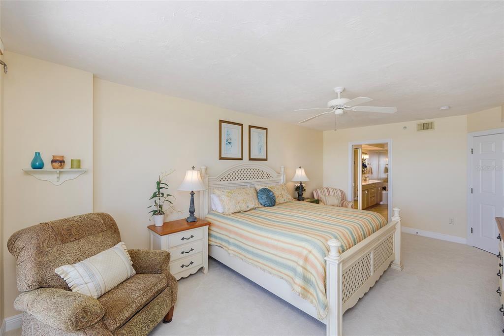 4631 South Atlantic Avenue, Unit 8601 Ponce Inlet, FL 32127 - Photo 40 of 64 a bedroom with a bed couch and window