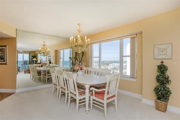 a kitchen with granite countertop a refrigerator and a stove top oven