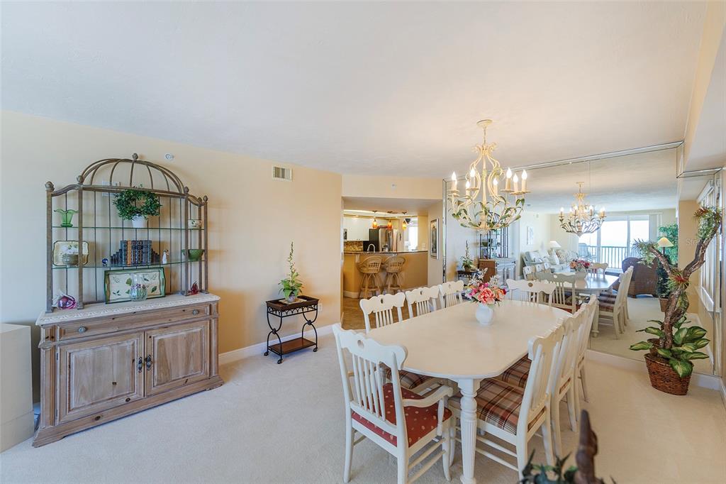 4631 South Atlantic Avenue, Unit 8601 Ponce Inlet, FL 32127 - Photo 43 of 64 a view of a dining room with furniture and chandelier
