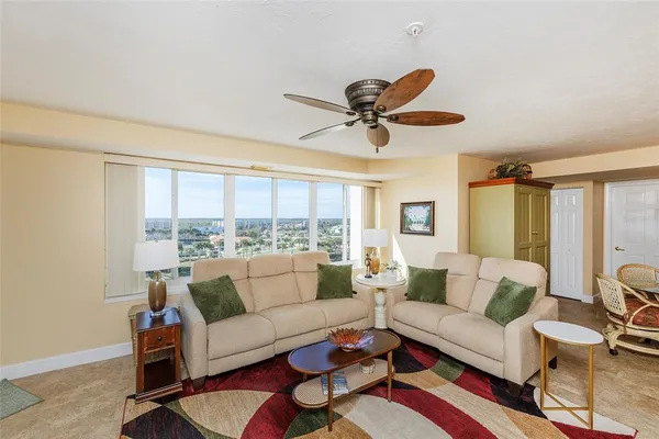 a living room with furniture and a large window
