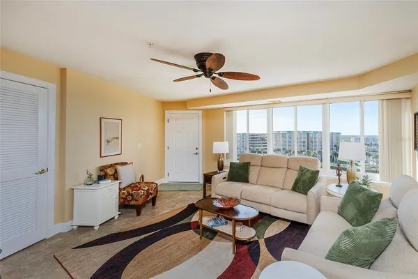 a living room with furniture and a large window