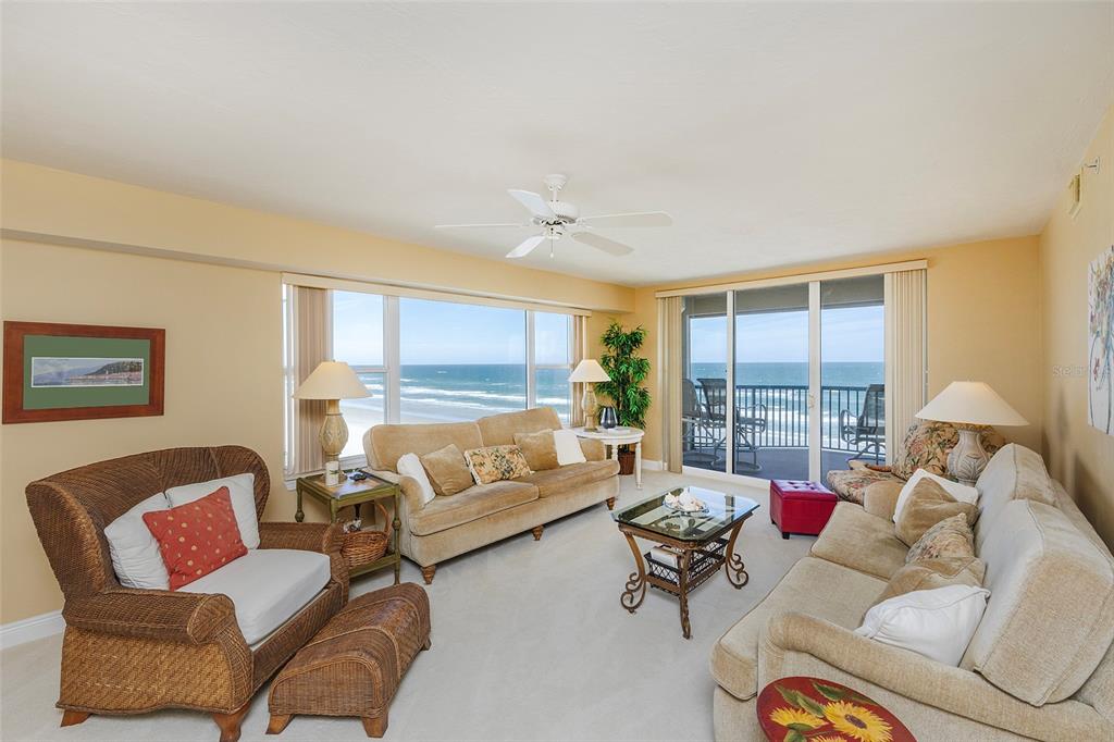 4631 South Atlantic Avenue, Unit 8601 Ponce Inlet, FL 32127 - Photo 56 of 64 a living room with furniture and a large window