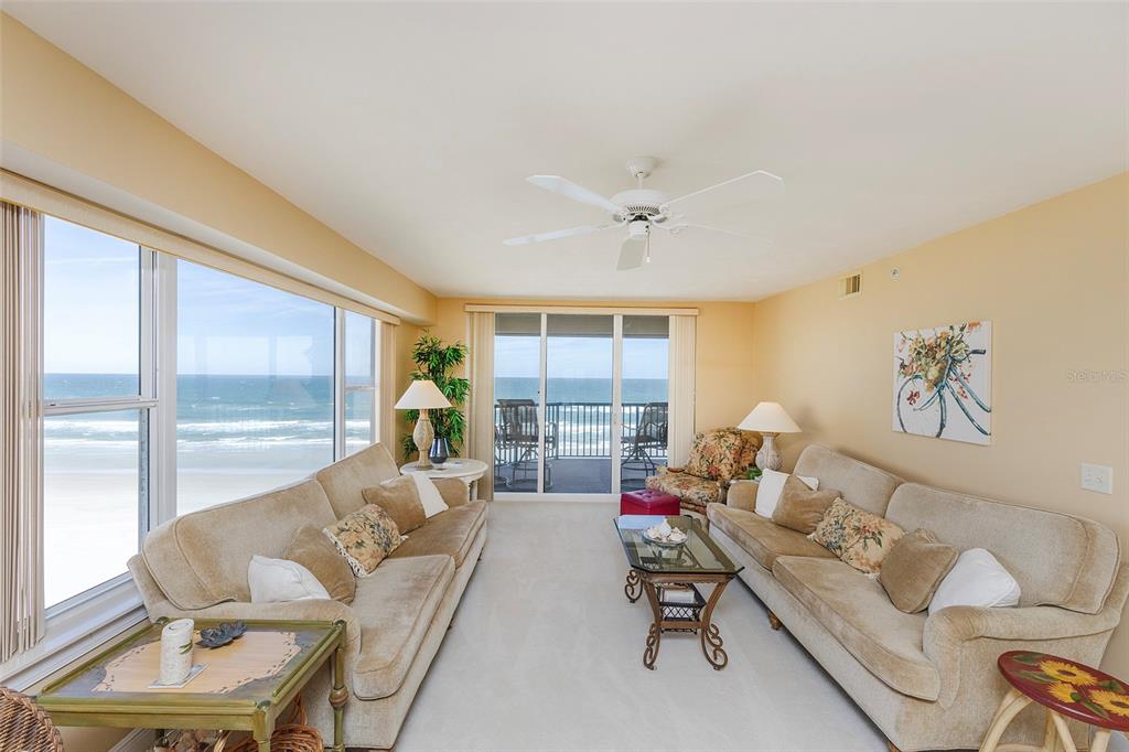 4631 South Atlantic Avenue, Unit 8601 Ponce Inlet, FL 32127 - Photo 57 of 64 a living room with furniture and a large window