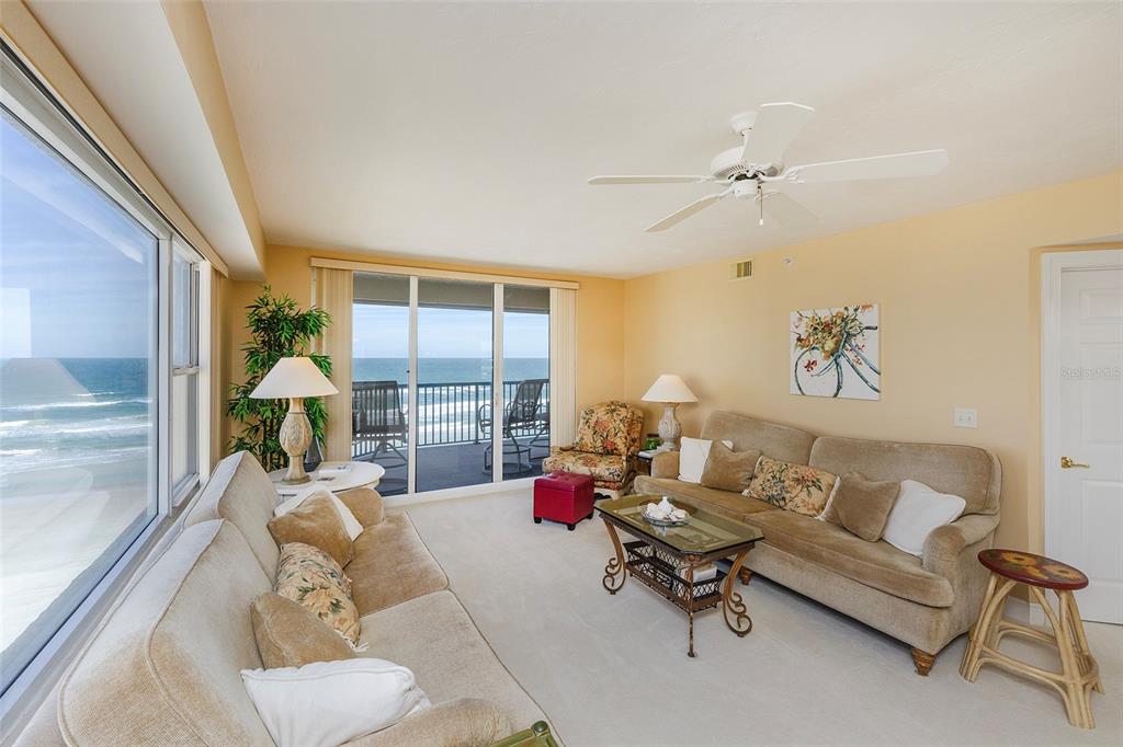 4631 South Atlantic Avenue, Unit 8601 Ponce Inlet, FL 32127 - Photo 58 of 64 a living room with furniture and a large window