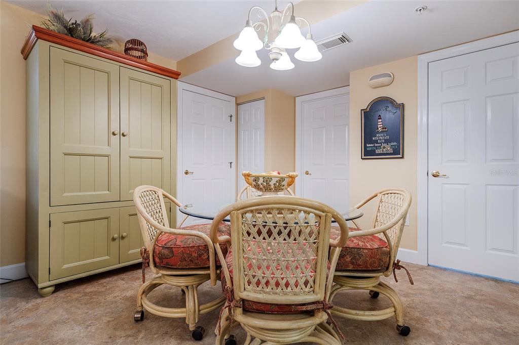 4631 South Atlantic Avenue, Unit 8601 Ponce Inlet, FL 32127 - Photo 62 of 64 a view of a dining room with furniture and chandelier