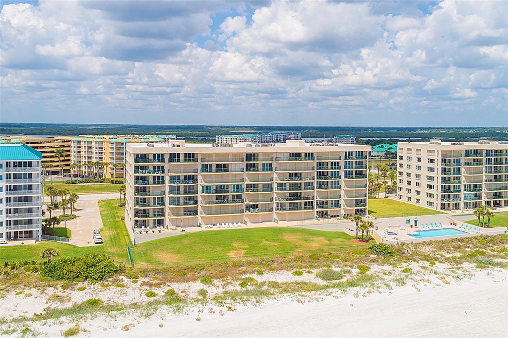 4631 South Atlantic Avenue, Unit 8601 Ponce Inlet, FL 32127 - Photo 64 of 64 a view of a house with a swimming pool and sitting area