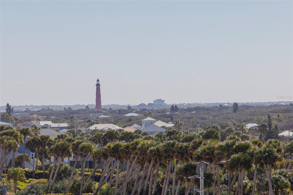 4631 South Atlantic Avenue, Unit 8601 Ponce Inlet, FL 32127 - Photo 9 of 64 an aerial view of a city with lots of residential buildings